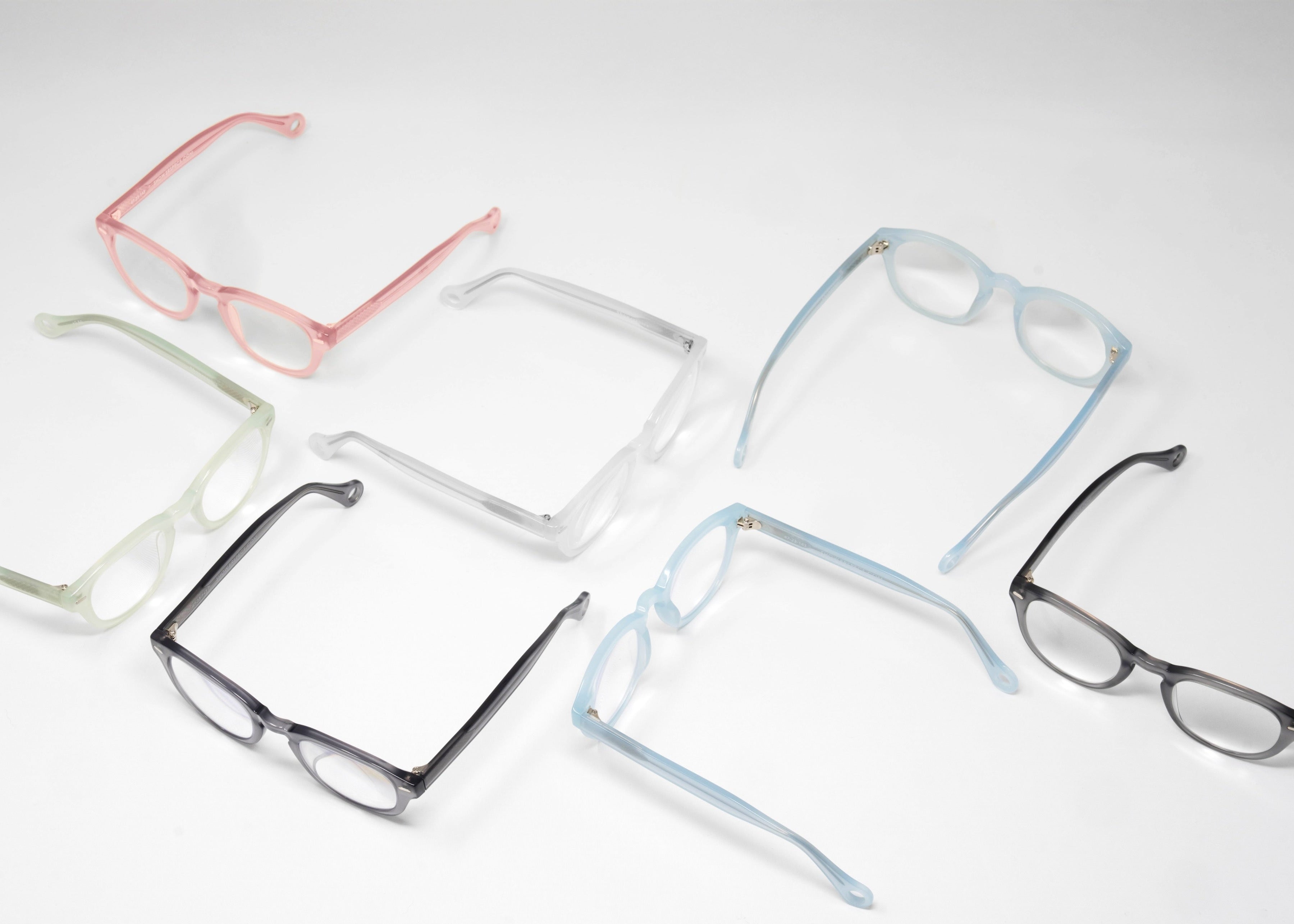 Showerspecs anti-fogging reading glasses in a variety of colors arranged on a white background.