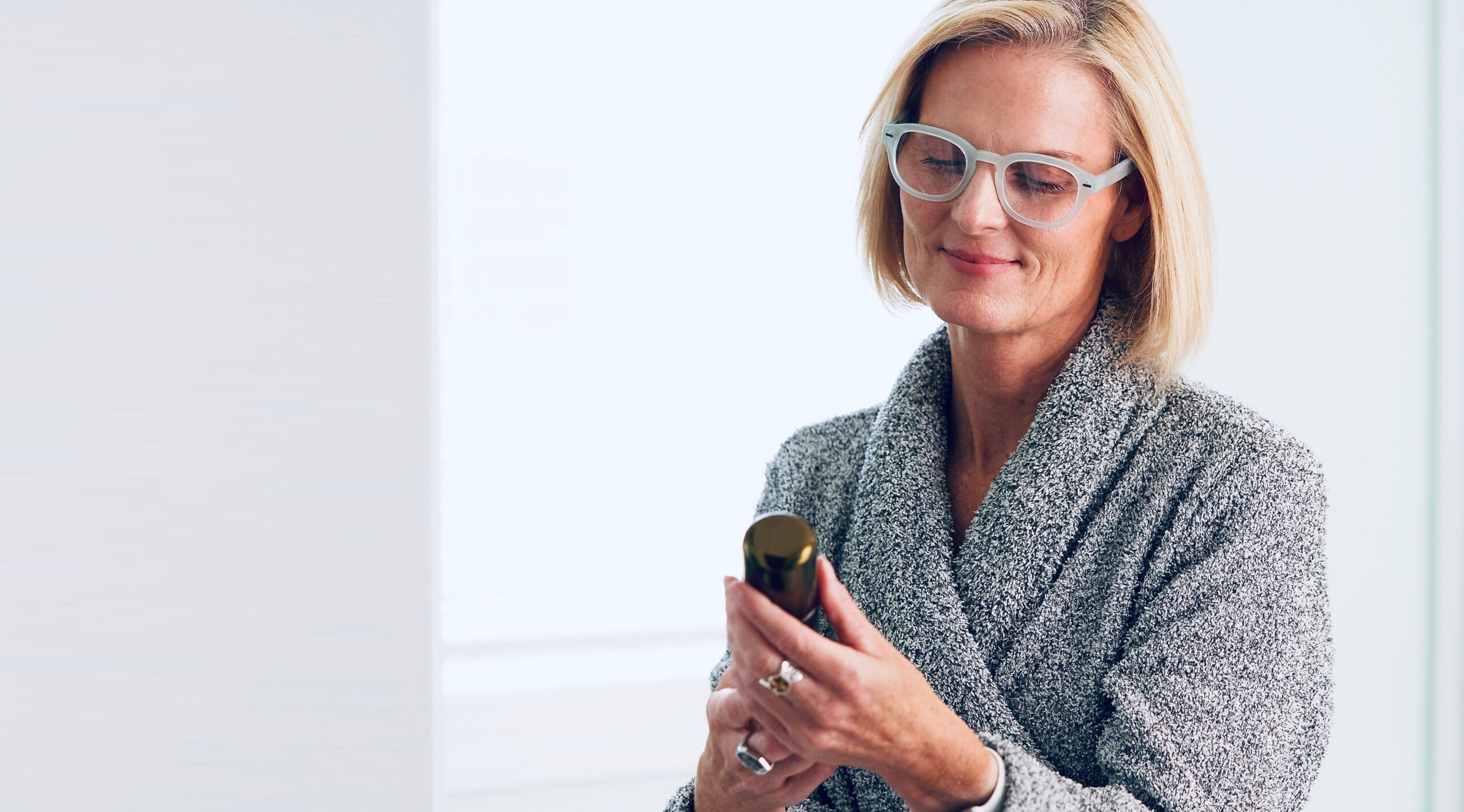 Woman reading a label with Showerspecs